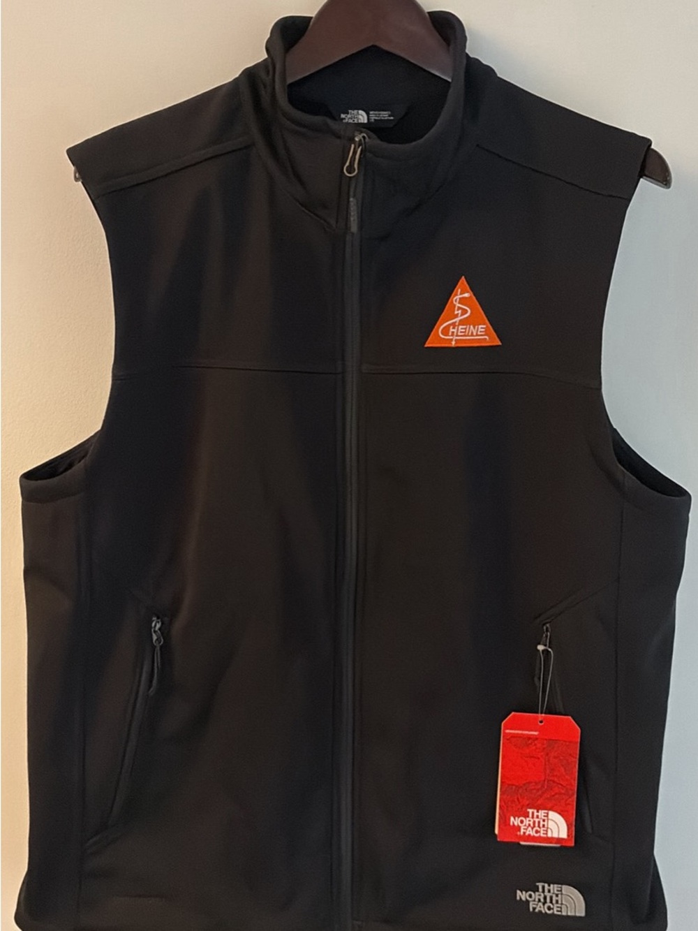 The North Face Men's Black Softshell Vest with Orange Patch